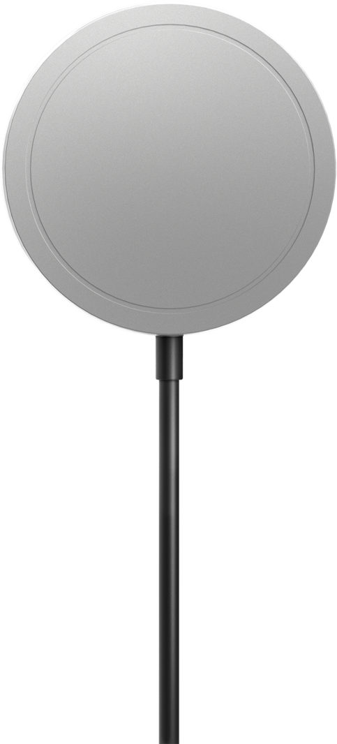 Un oggetto circolare grigio con uno stelo nero. È un caricatore wireless. Lo sfondo è nero.