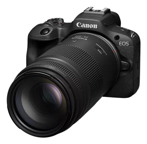 Schwarze Canon EOS Kamera mit großem Objektiv. Das Objektiv zeigt zum Betrachter. Die Kamera ist auf weißem Hintergrund.