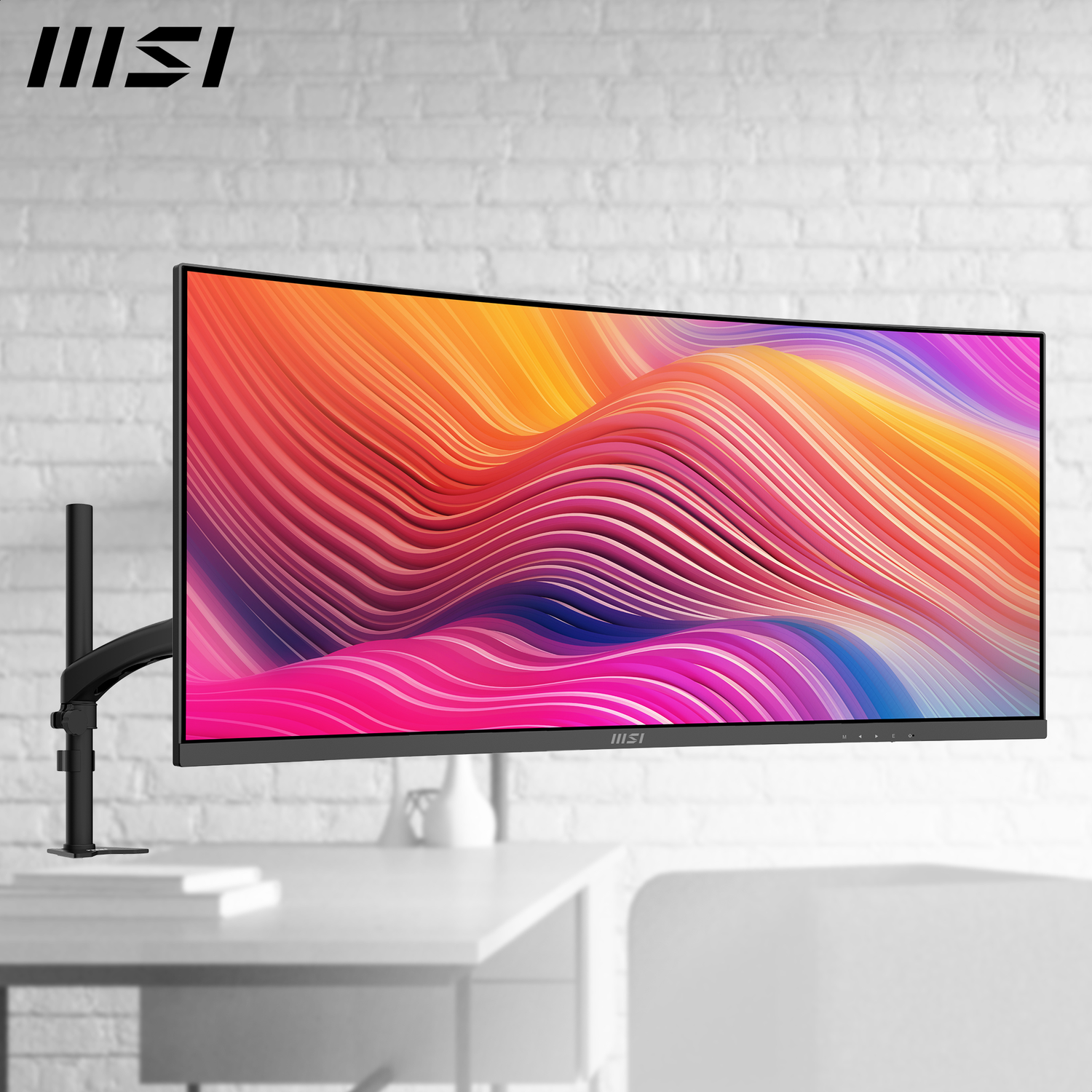 Curved monitor on a desk. Displaying a colorful abstract image. White brick wall in the background. Monitor arm is black.