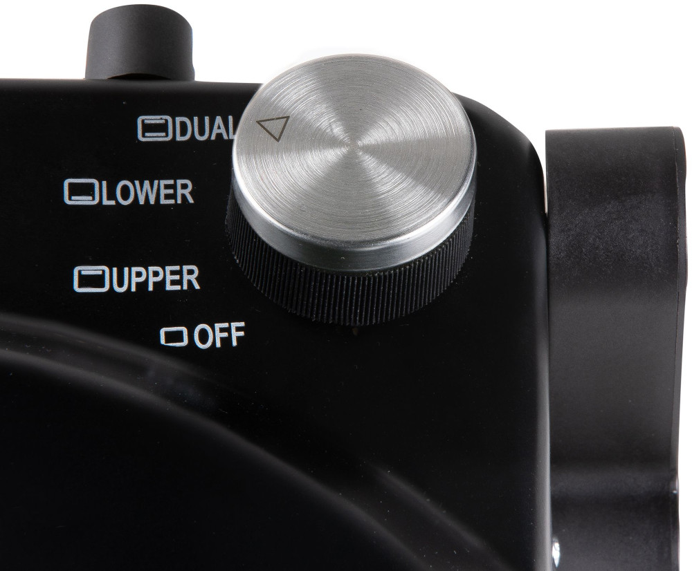 Close-up of a black device with a silver knob and control options: Dual, Lower, Upper, and Off. A black cylinder is also visible.