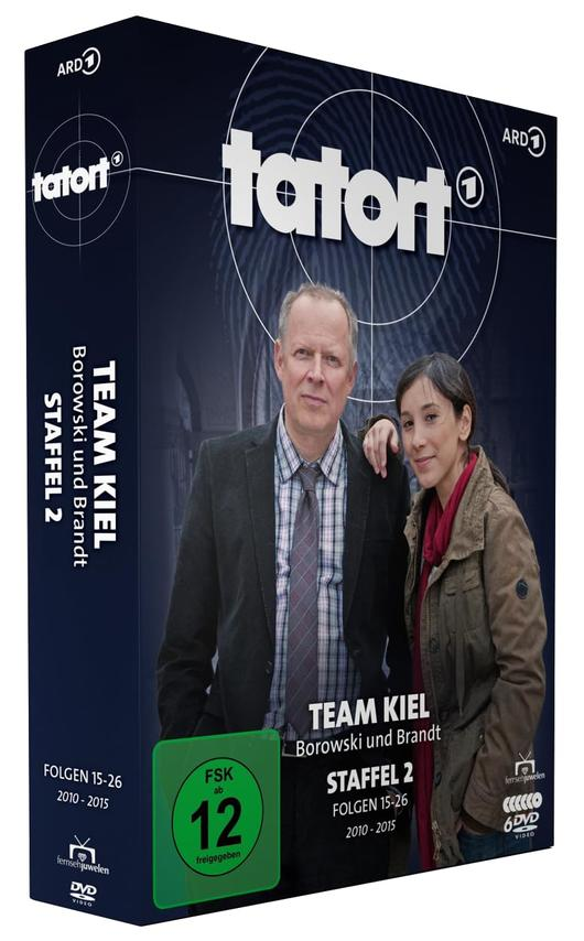 DVD-Box-Set von "Tatort: Team Kiel". Zeigt zwei Personen, einen Mann und eine Frau. Text enthält Serientitel, Episodendetails und Altersfreigabe.