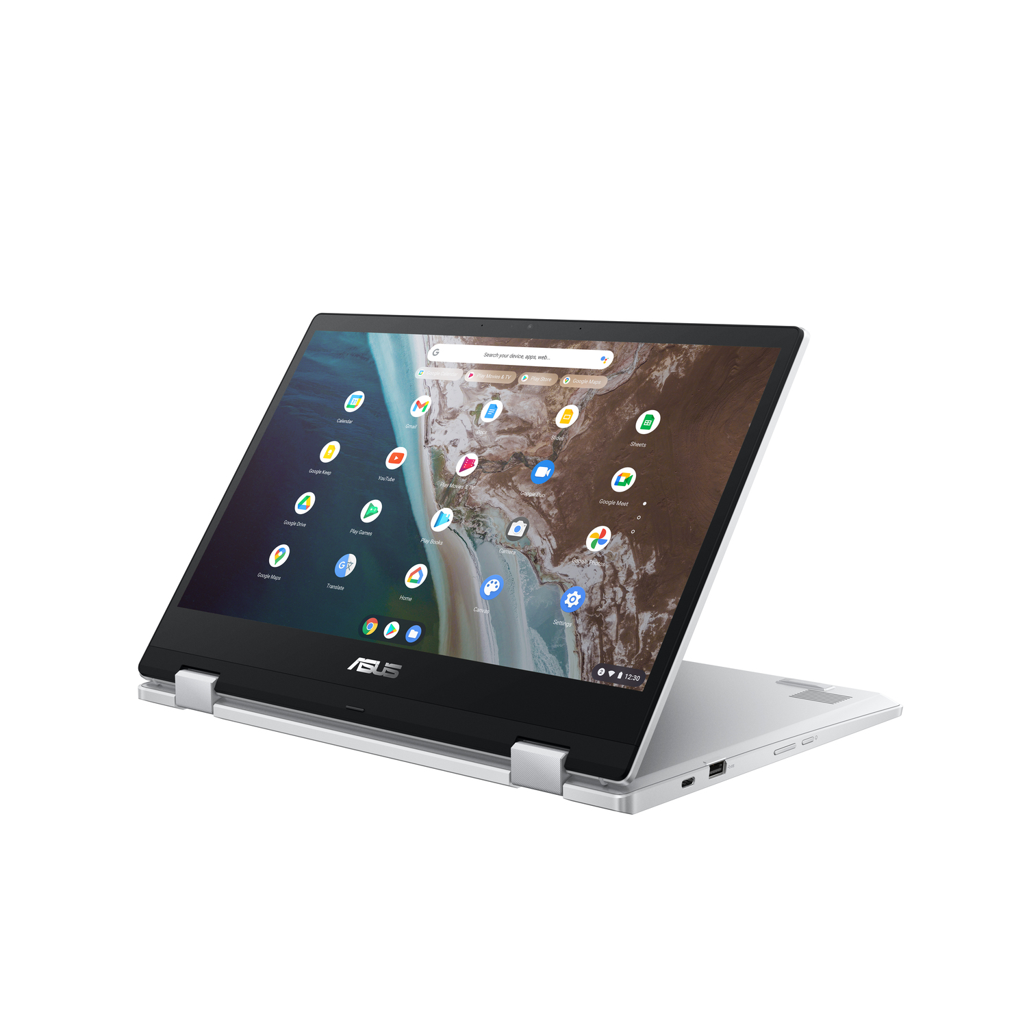 Un ordinateur portable ASUS argenté est ouvert, affichant des icônes d'applications. L'écran affiche une barre de recherche Google et des icônes d'applications.