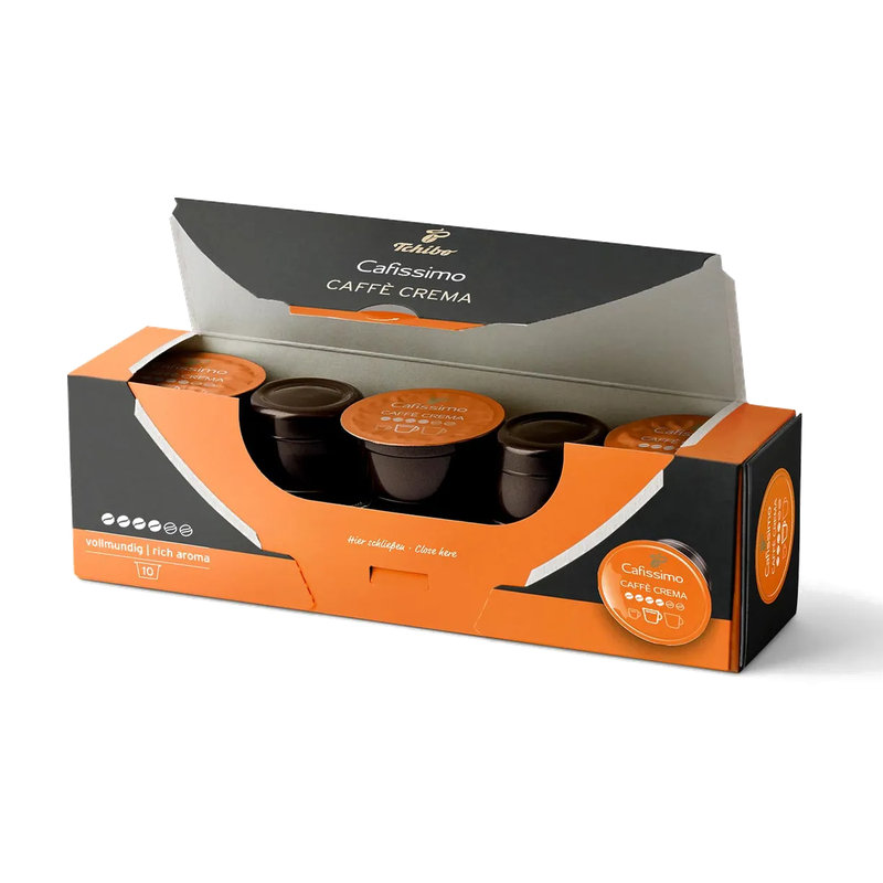 Pudełko kapsułek do kawy Cafissimo Caffe Crema. Pudełko jest czarno-pomarańczowe, z widocznymi kapsułkami. Białe tło.