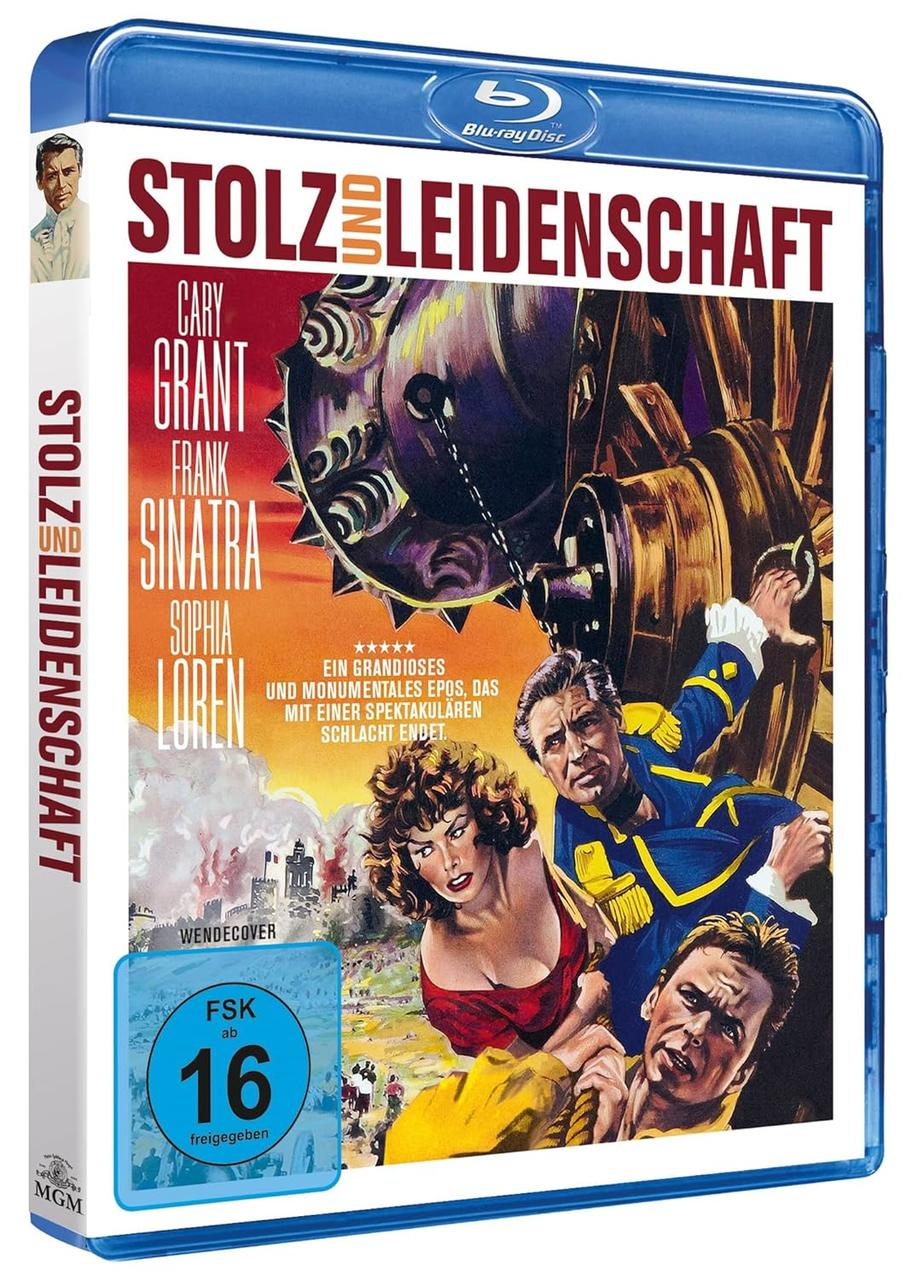 Blu-ray-Cover des Films 'Stolz und Leidenschaft'. Cary Grant, Frank Sinatra und Sophia Loren sind zu sehen. Im Hintergrund ein großes Zahnrad.