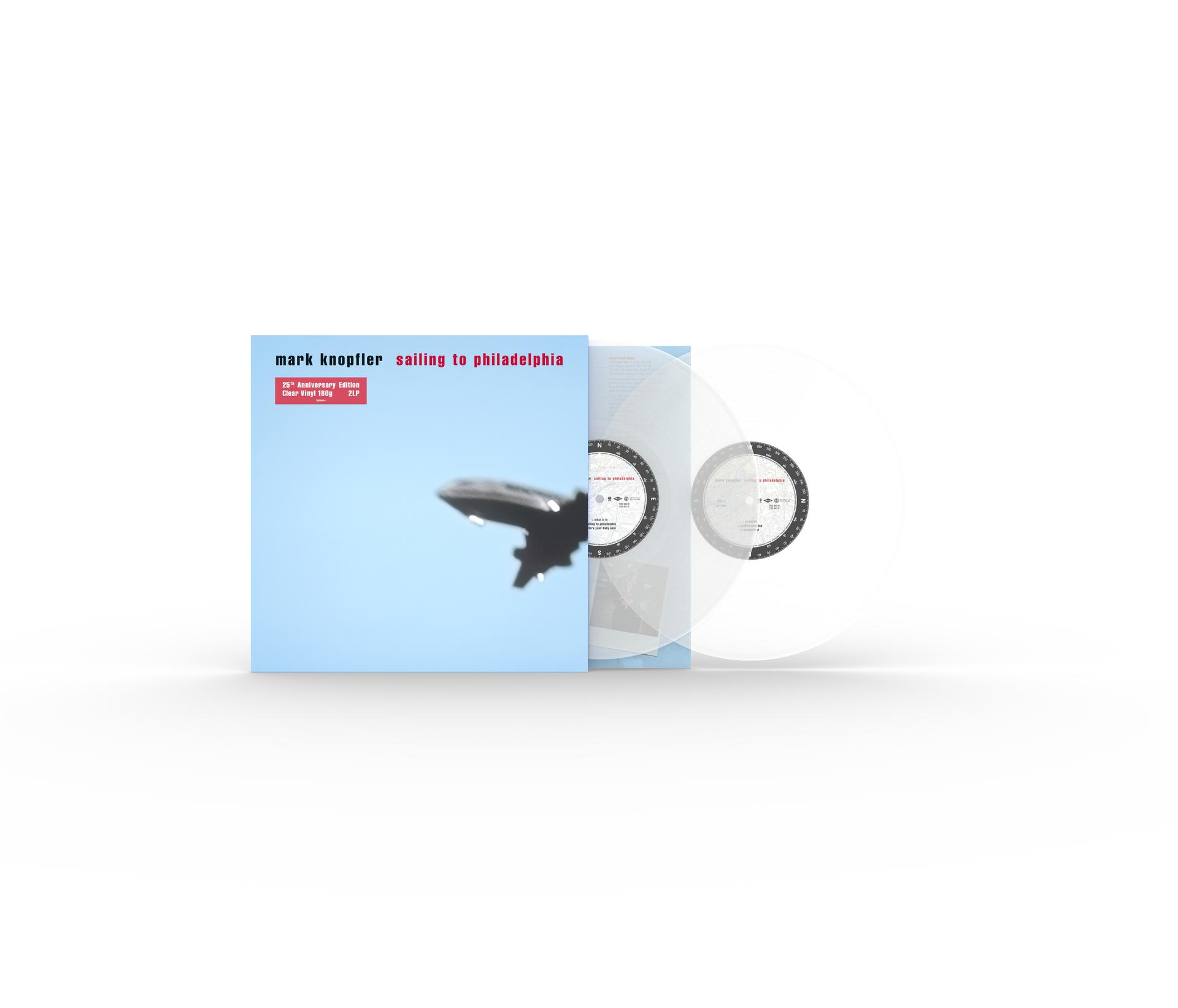 Albumcover mit Flugzeugsilhouette vor blauem Himmel. Klare Vinylplatten sind rechts sichtbar.