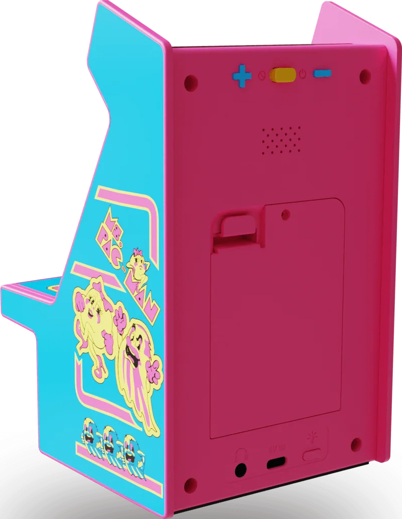 Mini-borne d'arcade aux couleurs rose et bleu. Le côté montre des personnages de Pac-Man. Boutons et ports visibles à l'arrière.