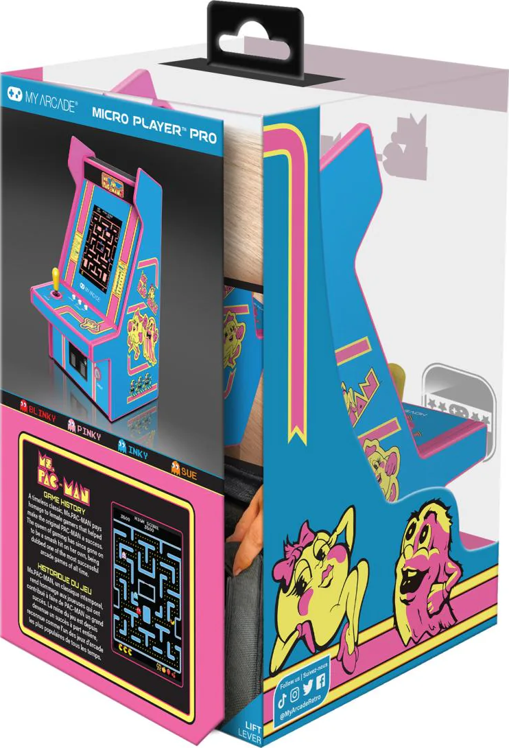 Une borne d'arcade Ms. Pac-Man bleue et rose est présentée dans sa boîte. La boîte contient des illustrations des personnages du jeu.