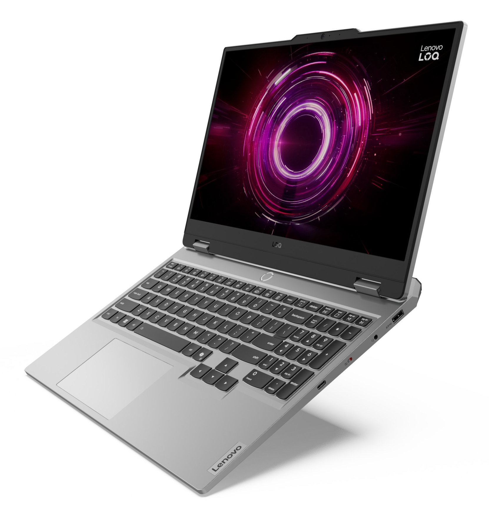 Srebrny laptop Lenovo LOQ. Ekran wyświetla fioletowo-różowy okrągły wzór. Widoczna klawiatura i logo Lenovo.