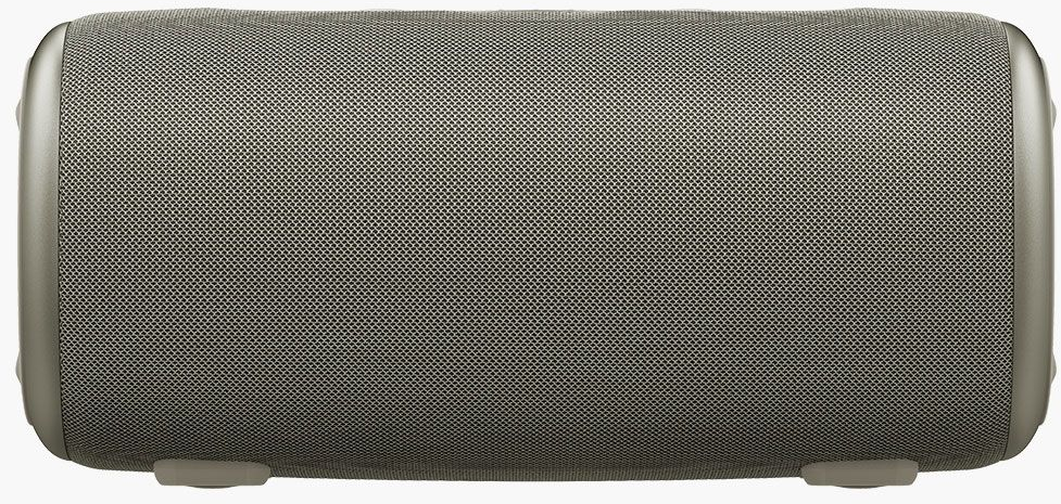 Un haut-parleur cylindrique avec une façade en mesh gris et des bords argentés. Petits pieds en bas.