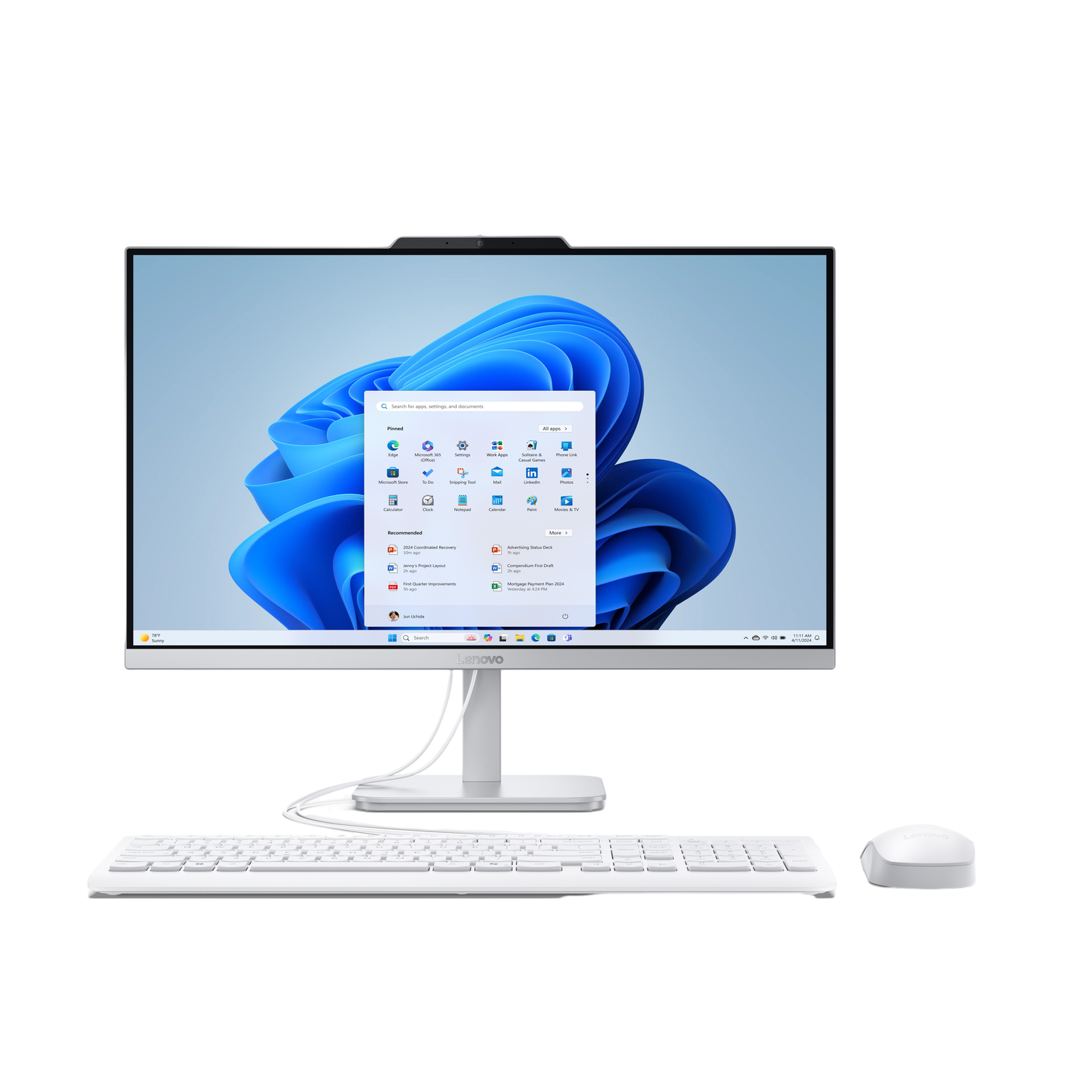 Un ordinateur tout-en-un Lenovo blanc sur fond noir. L'écran affiche l'interface Windows 11 avec un fond bleu.