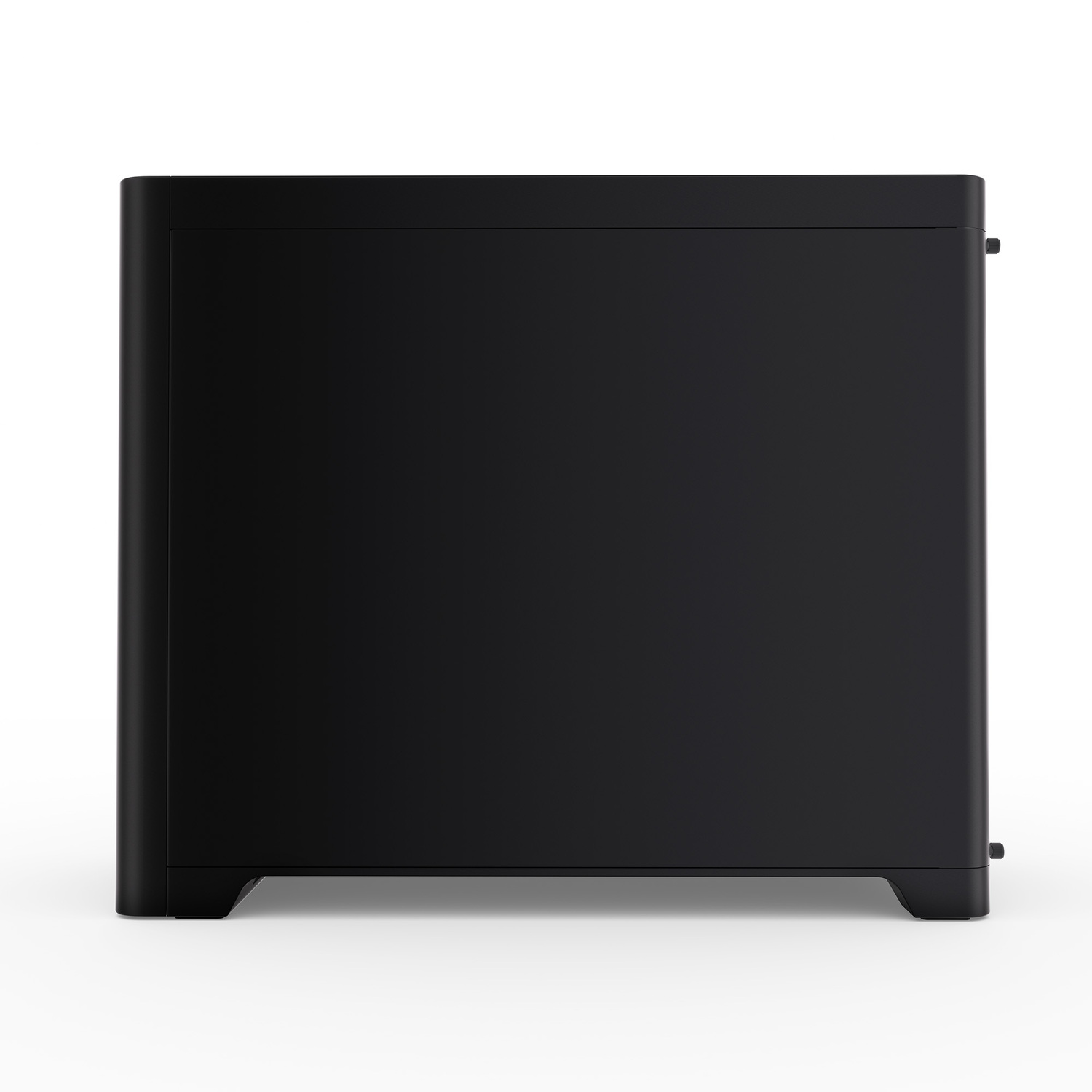 A black, rectangular device with rounded edges stands on a white surface. It appears to be a computer case.