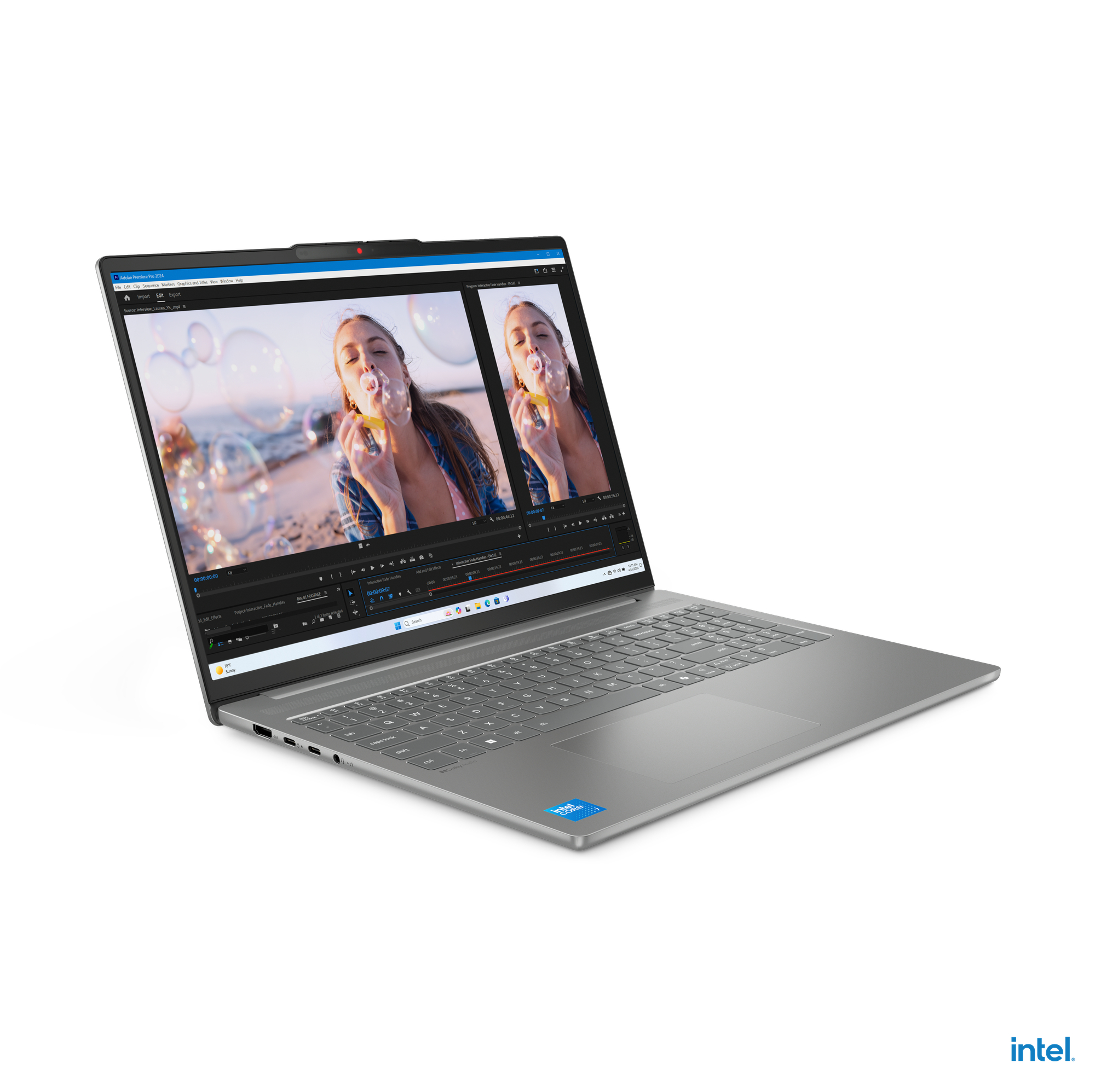 Laptop mit Videobearbeitungssoftware. Bildschirm zeigt eine Frau beim Seifenblasenblasen. Intel-Aufkleber sichtbar.