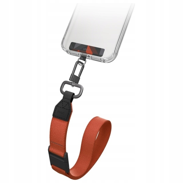 Przezroczyste etui na telefon z paskiem. Pasek jest pomarańczowo-czarny, przymocowany do telefonu. Telefon jest pod kątem.