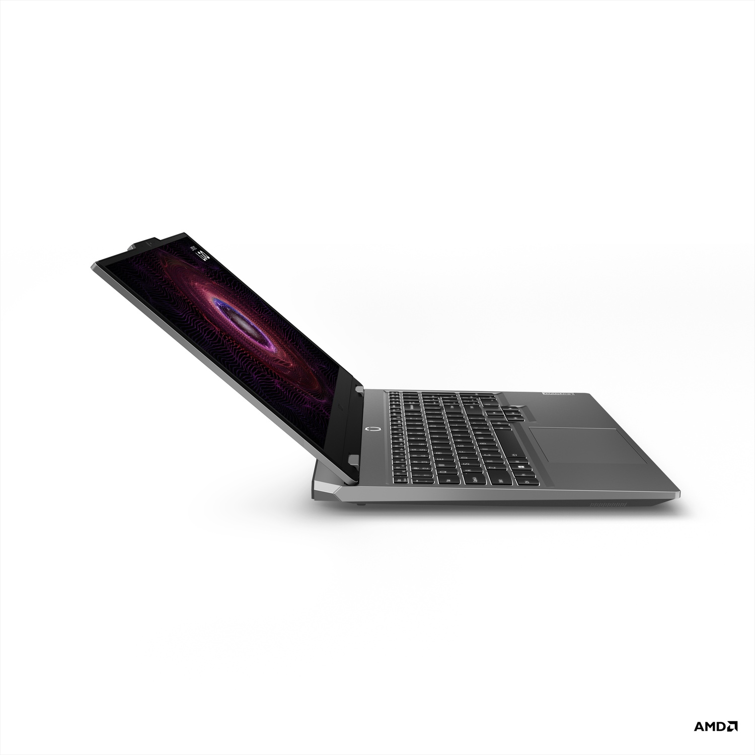 Un ordinateur portable gris est ouvert, affichant un design de galaxie violet et noir sur l'écran. Le clavier est visible. Logo AMD en bas.