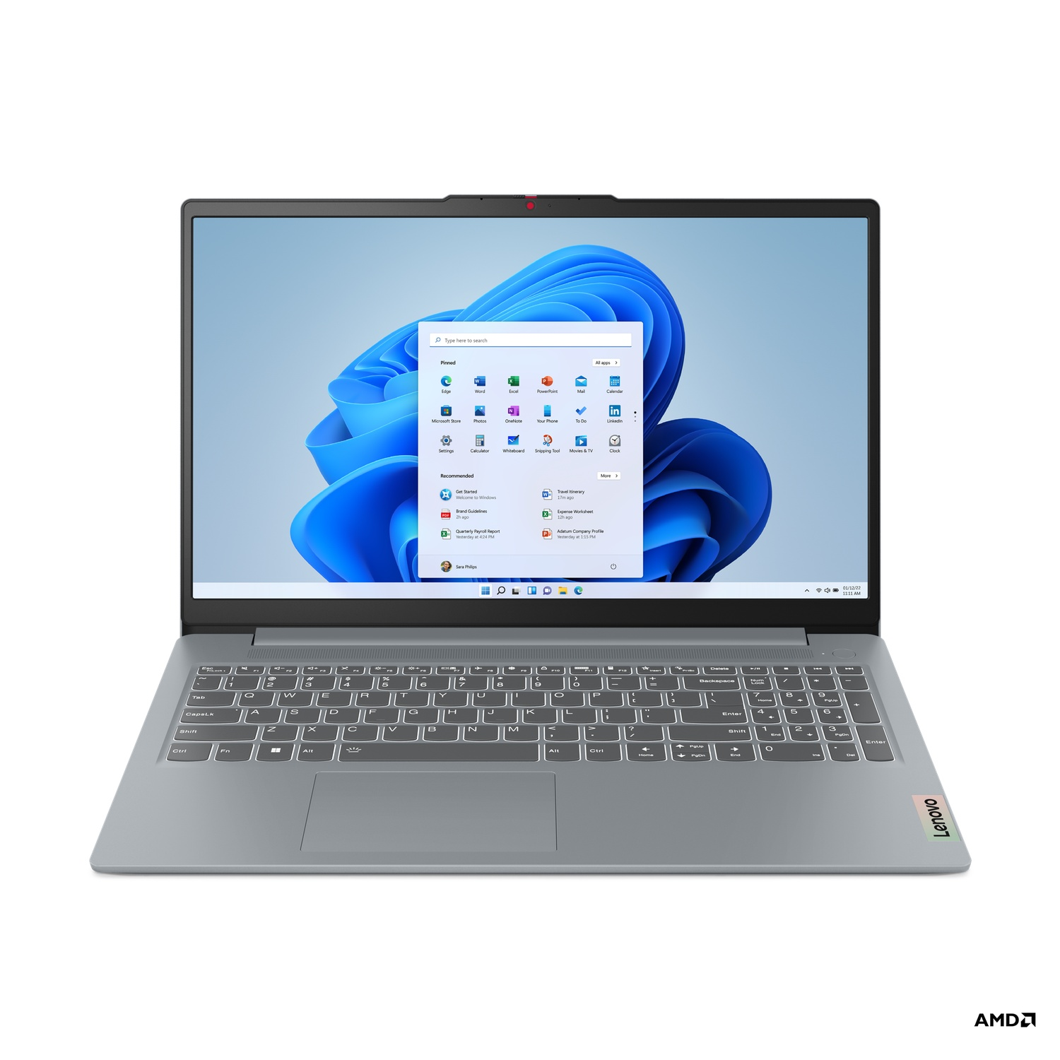 Un ordinateur portable Lenovo est ouvert, affichant l'écran d'accueil de Windows 11. Le clavier est visible. Logo AMD en bas à droite.