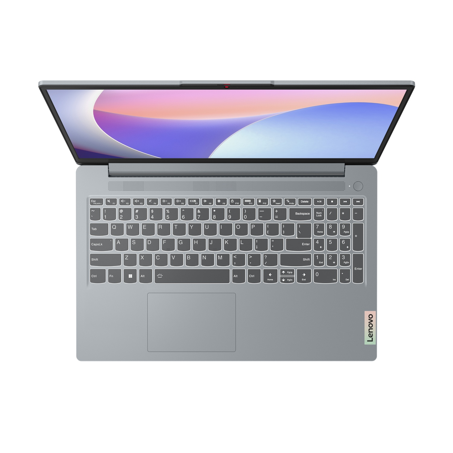 Een zilveren Lenovo laptop open op een wit oppervlak. Het scherm toont een verloop. Toetsenbord en touchpad zijn zichtbaar.
