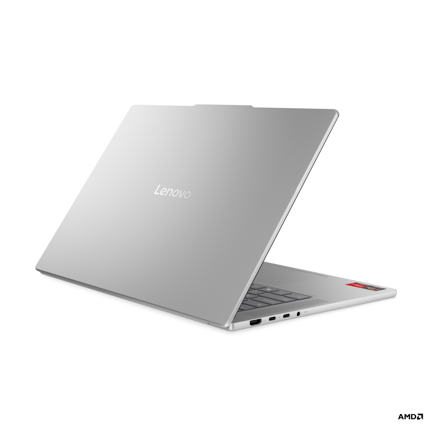 A silver Lenovo laptop is slightly open, revealing the keyboard and ports. The AMD logo is visible in the bottom right corner.