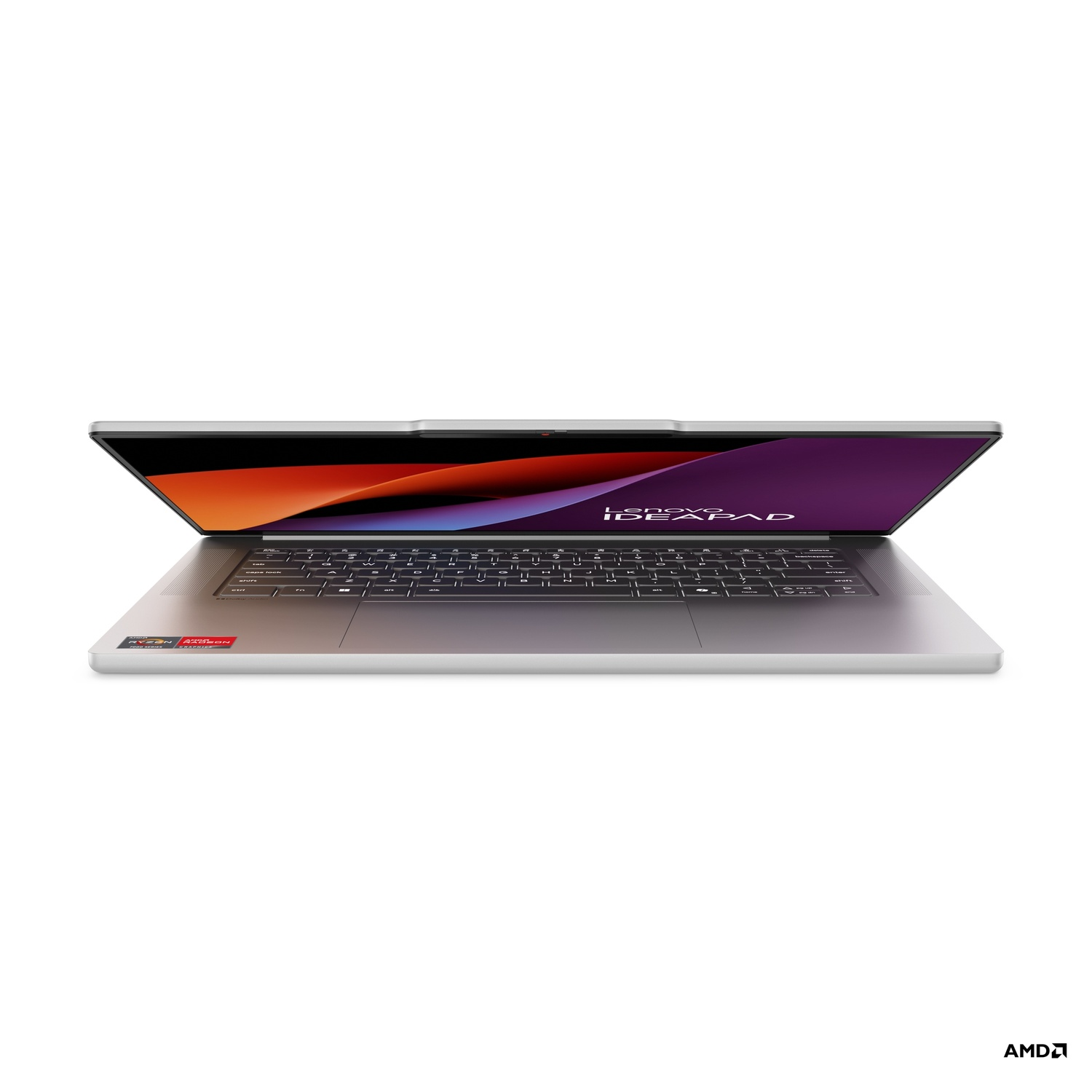 Laptop Lenovo IdeaPad open, screen showing a colorful image. Keyboard visible, AMD logo on the bottom left.