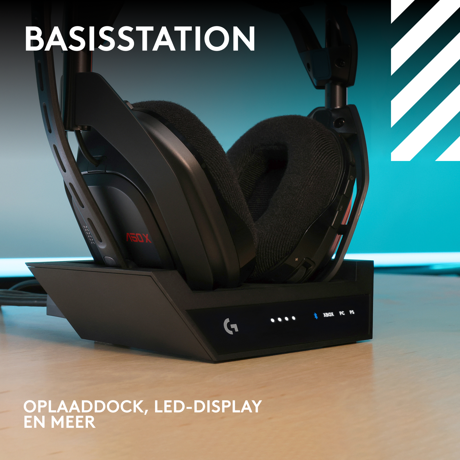 Black headset on a charging dock. The dock has an LED display. The background is teal and white.