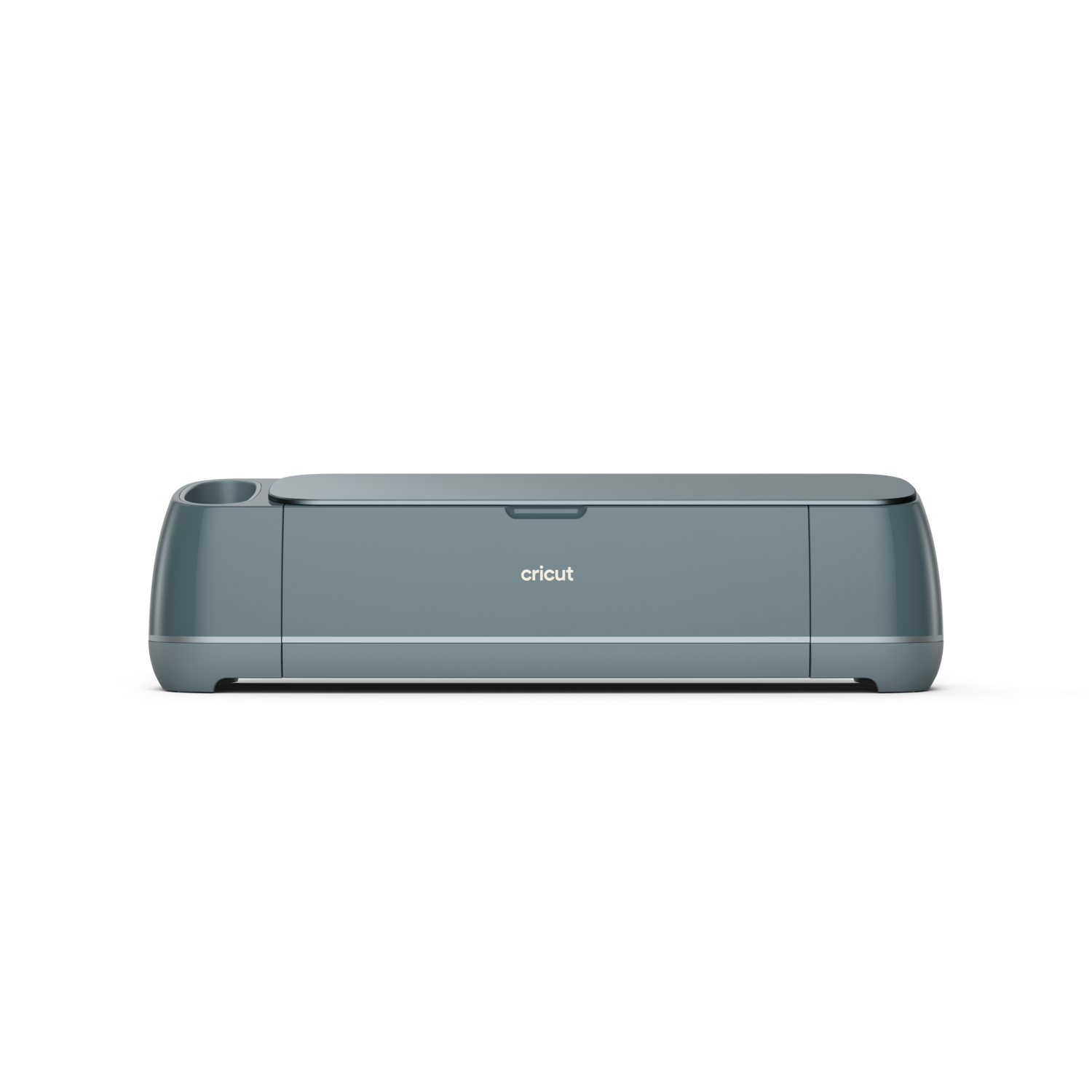 A teal Cricut cutting machine, angled slightly. The word 'cricut' is visible. The background is solid black.