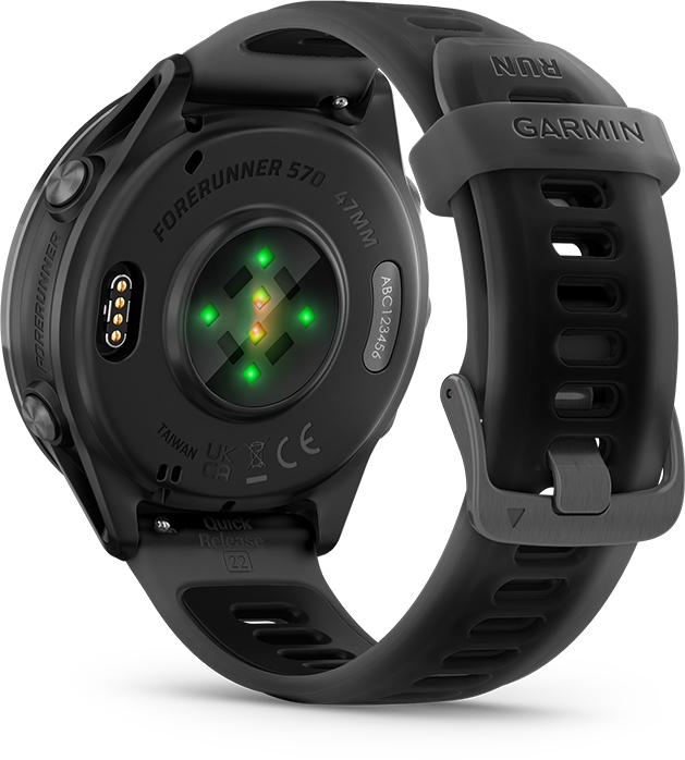 Fekete Garmin Forerunner 570 óra szürke szíjjal. A hátoldalon érzékelők és szöveg, köztük 'GARMIN' és 'RUN' látható.
