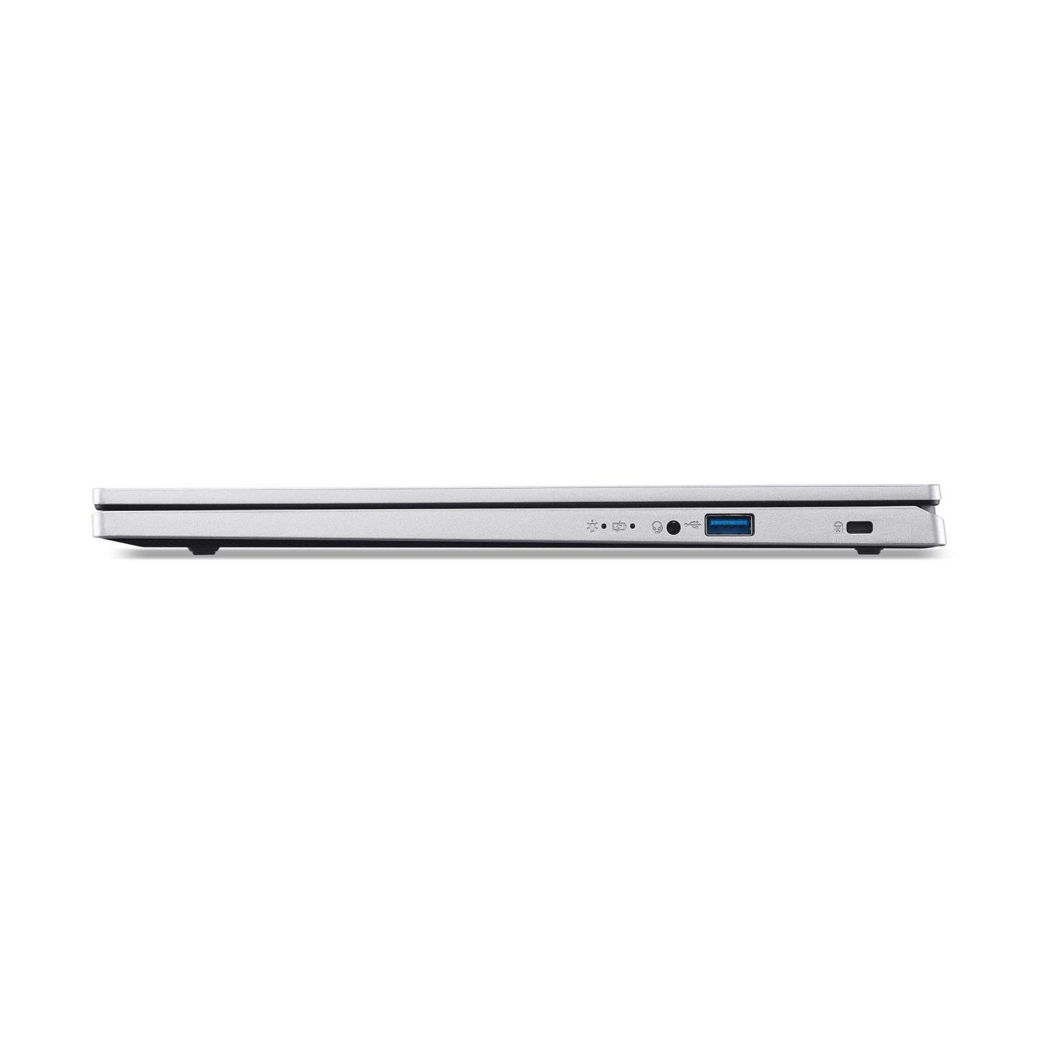 Vista laterale di un laptop argentato. Sono visibili le porte: USB, ricarica, jack audio e pulsante di accensione. Il laptop è su sfondo bianco.