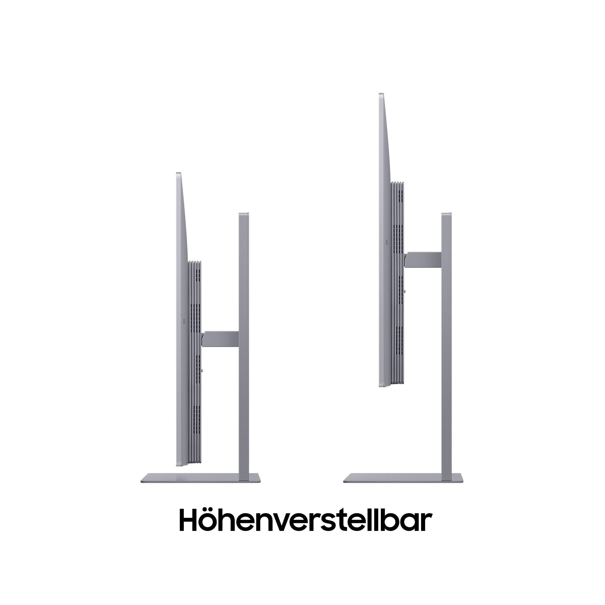 Zwei silberne Monitore mit höhenverstellbaren Ständern auf weißem Hintergrund. Der Text 'Höhenverstellbar' steht unten.