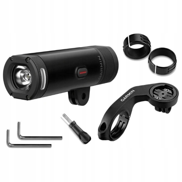 Czarna lampka rowerowa Garmin i akcesoria, w tym uchwyty montażowe, klucze imbusowe i mocowanie kierownicy, wszystko na białym tle.