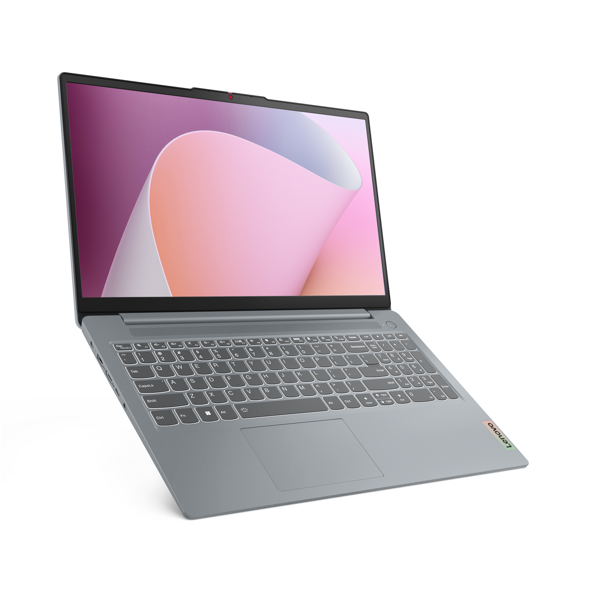 Een zilveren Lenovo-laptop, open om een toetsenbord en scherm te laten zien met een abstracte roze en witte achtergrond.