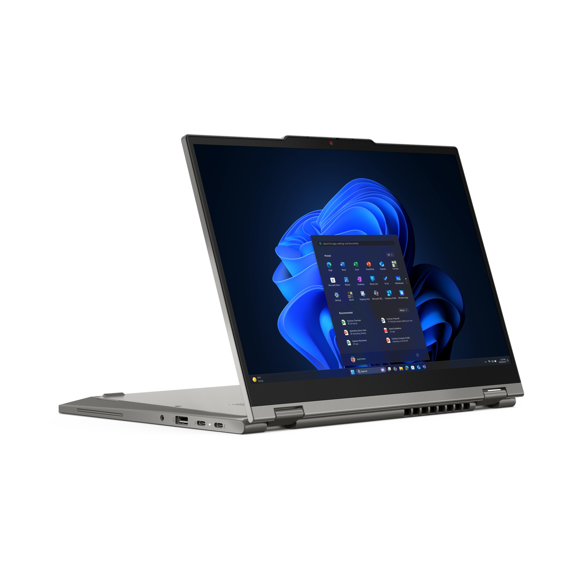 Ein silberner Laptop ist geöffnet und zeigt eine Windows-Oberfläche. Der Bildschirm zeigt blaue abstrakte Tapeten und Anwendungssymbole.