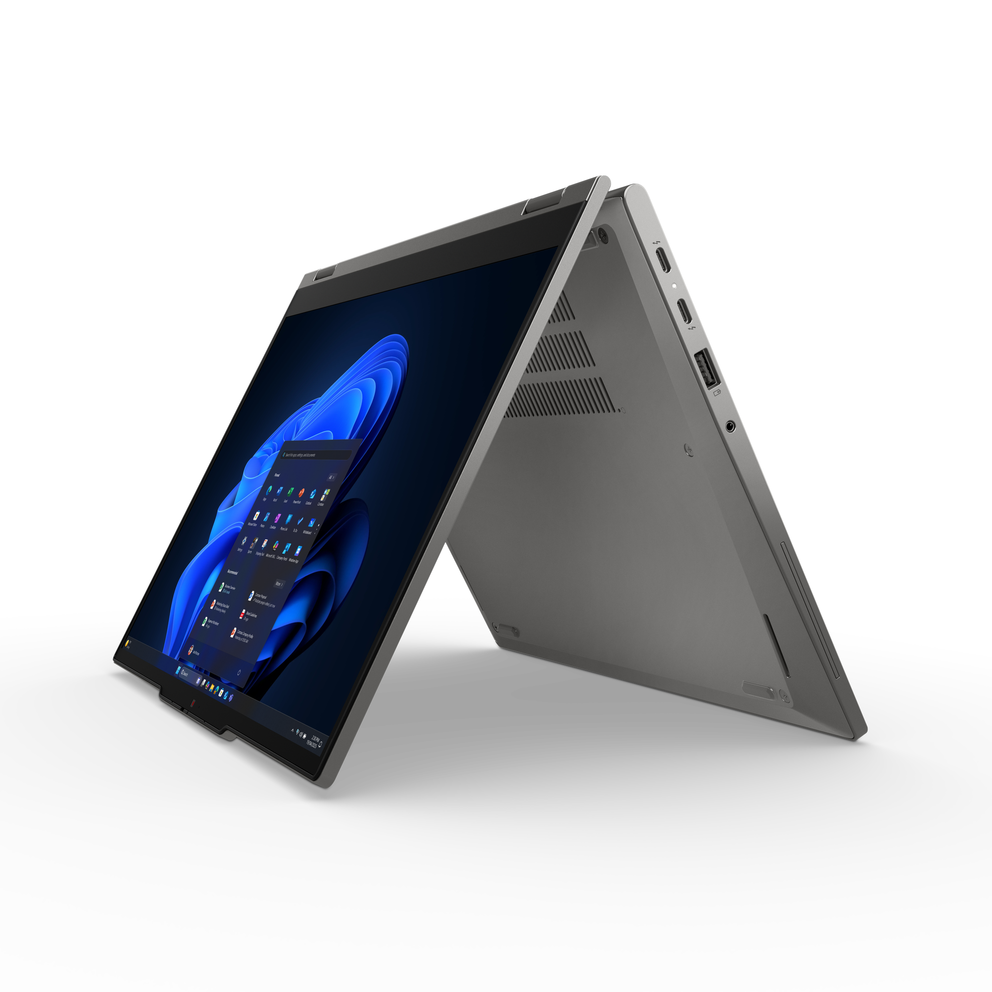 Ein grauer Laptop ist auf schwarzem Hintergrund geöffnet. Der Bildschirm zeigt eine Windows-Oberfläche mit blauen Akzenten.