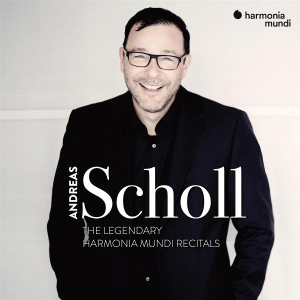 Mann mit Brille lächelt, trägt einen schwarzen Anzug. Text: 'Andreas Scholl'. Harmonia Mundi Logo.