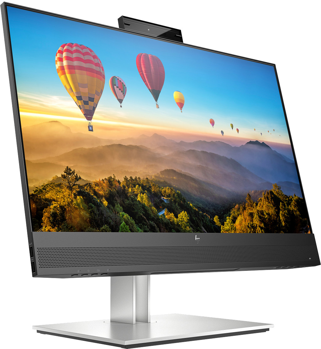 Ein HP-All-in-One-Computer zeigt Heißluftballons über einer Berglandschaft. Der Computer steht auf einem silbernen Ständer.