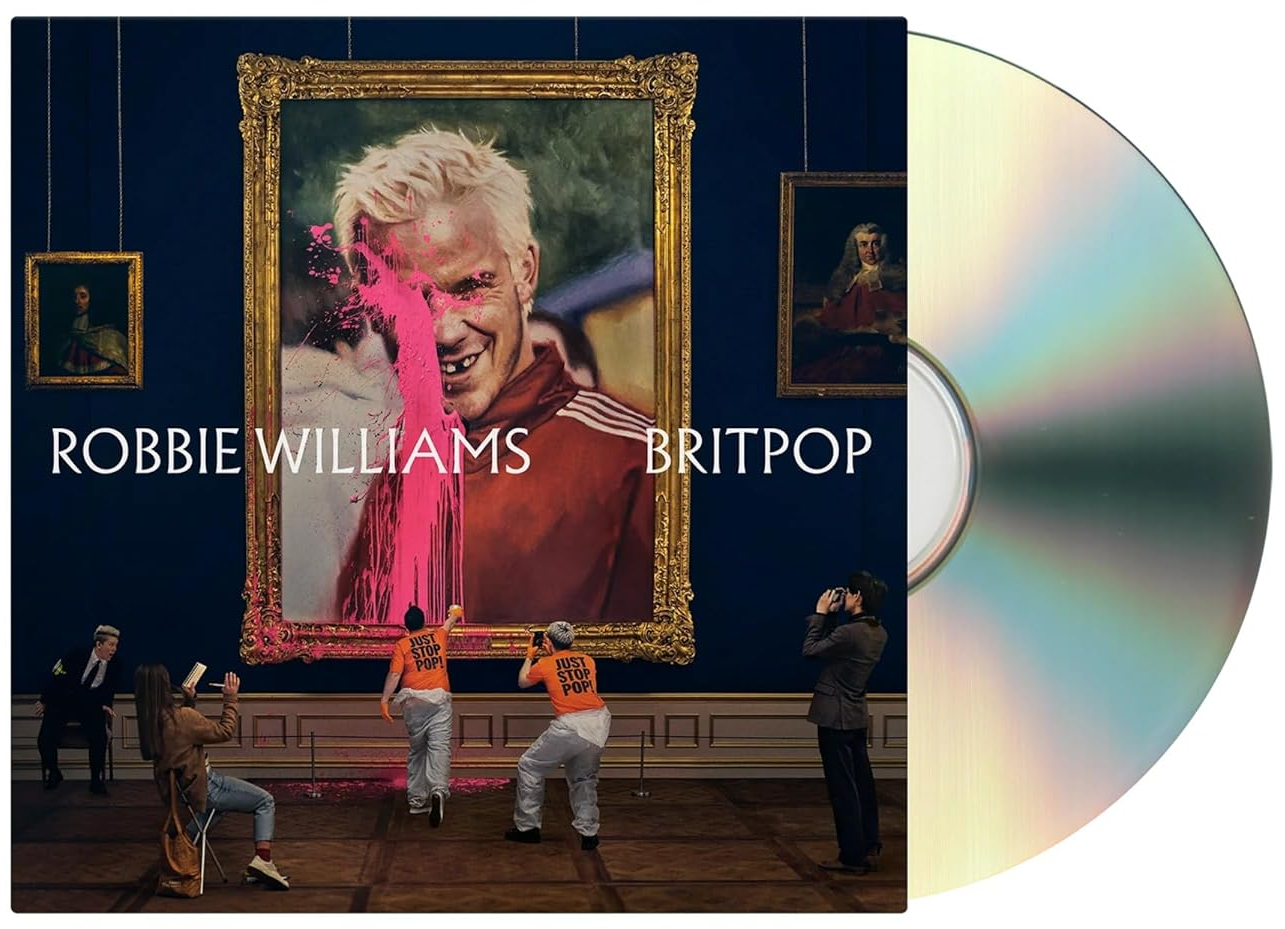 CD borító. Robbie Williams festménye rózsaszín festékkel fröcskölve. Emberek egy múzeumhoz hasonló szobában. CD jobbra.