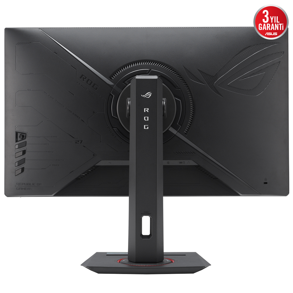 Siyah oyun monitörü arkası. ROG logosu, ASUS garanti etiketi. Kırmızı tabanlı stand. Detaylı doku ve tasarım öğeleri görünür.