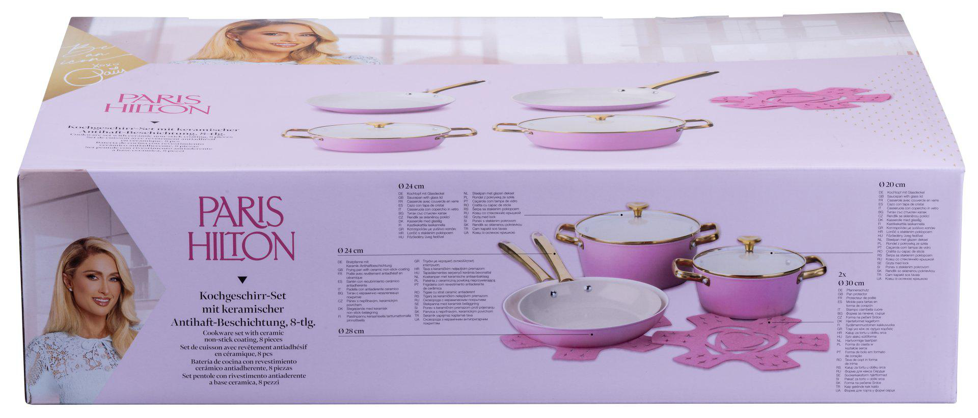 Rosa Paris Hilton Kochgeschirr-Set mit Pfannen und Töpfen, und ein Frauenkopf auf der Box.