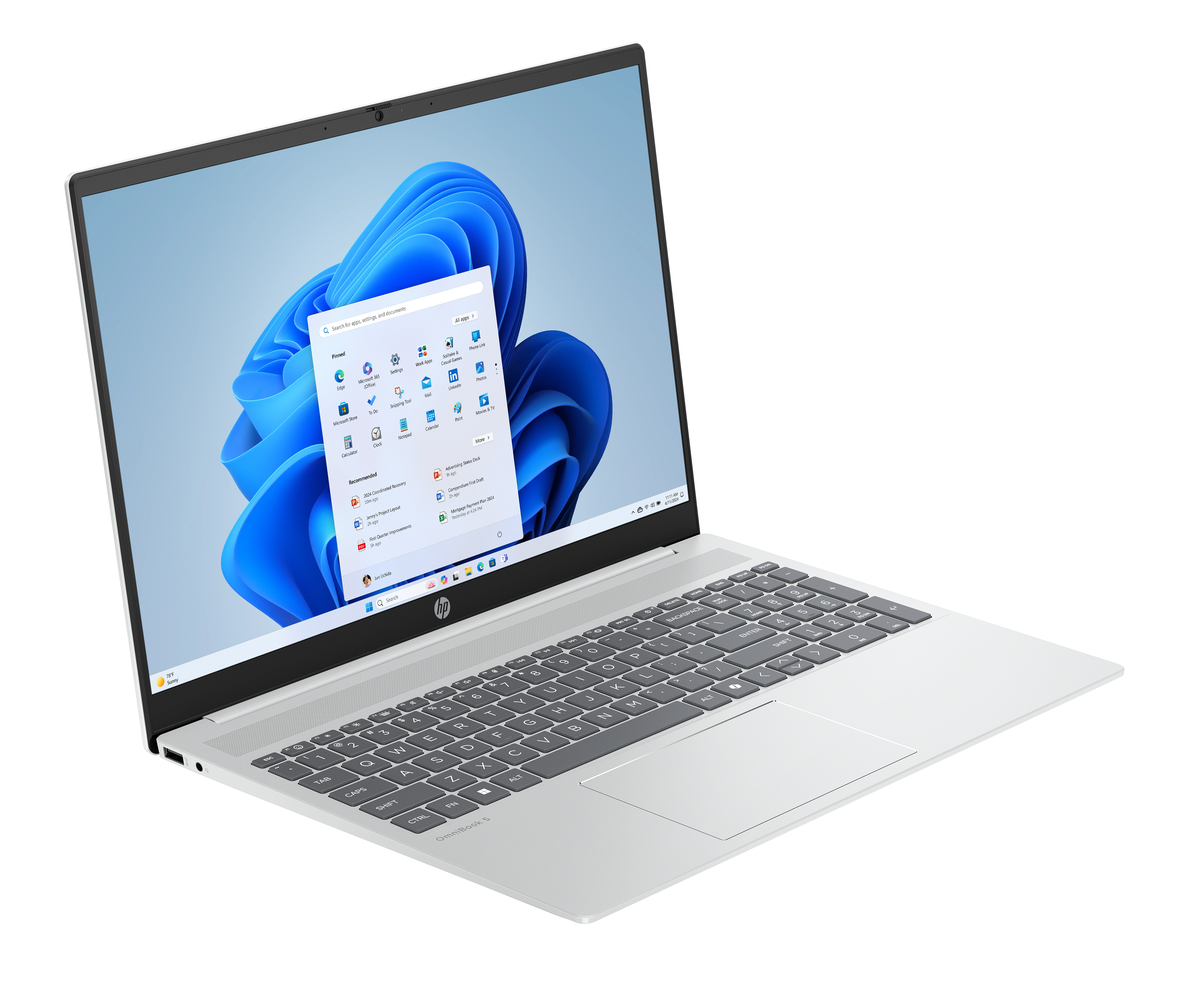 Silberner HP-Laptop mit geöffneter Windows 11-Oberfläche. Der Bildschirm zeigt App-Symbole und eine Suchleiste.