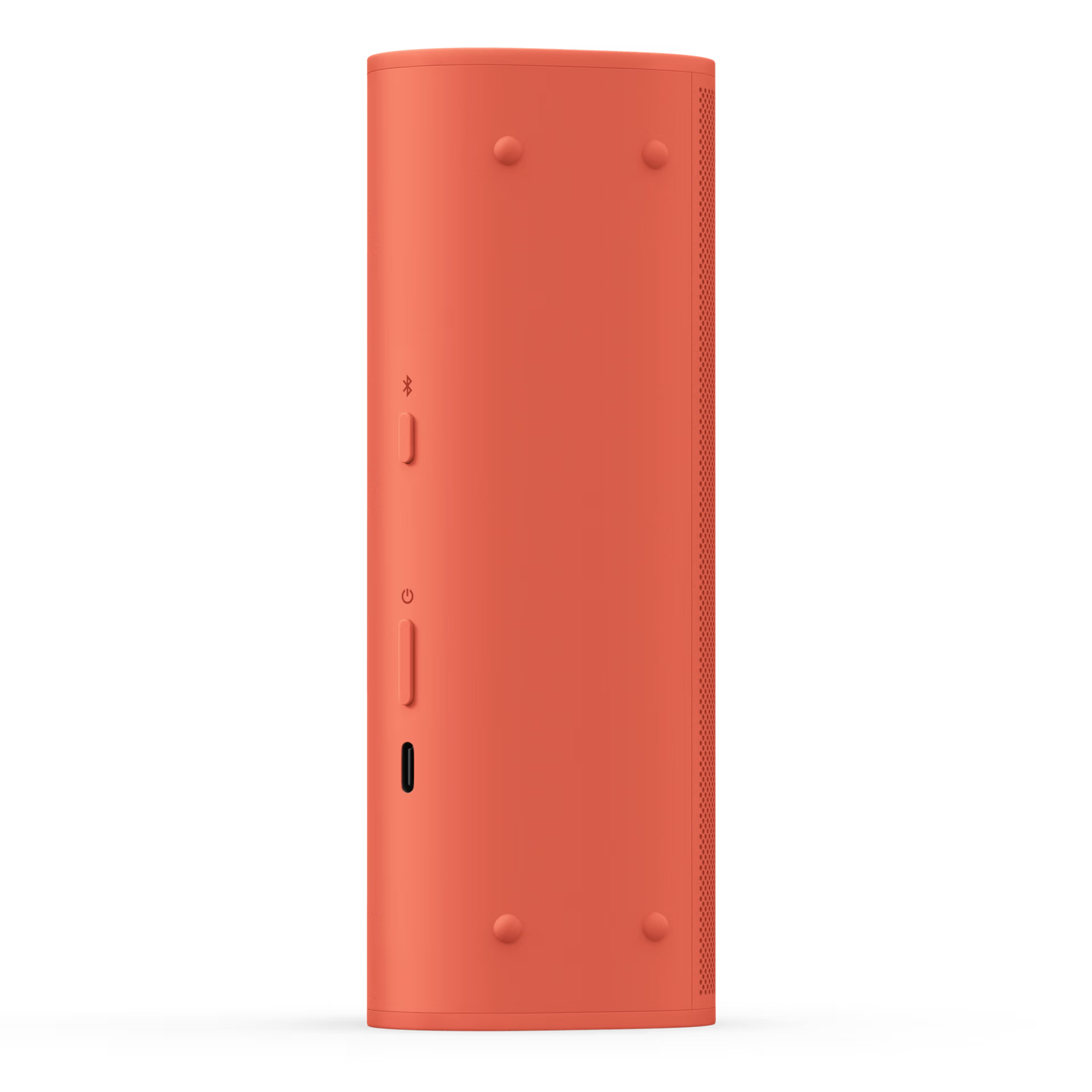 Egy korall színű hengeres hangszóró. Van rajta bekapcsoló, Bluetooth és USB-C port gomb. A háttér fekete.