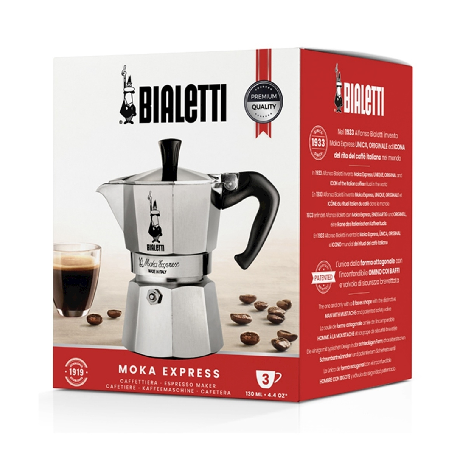 Una caffettiera Bialetti Moka Express su una scatola. Chicchi di caffè e un bicchiere di caffè nell'immagine.