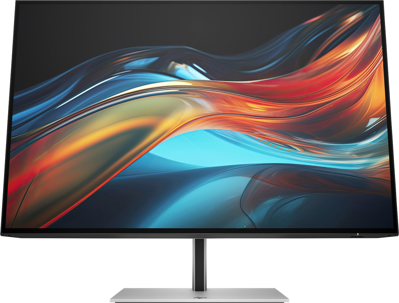 Ein Computermonitor zeigt ein abstraktes Design aus fließenden Farben: Rot, Orange, Blau und Gelb. Er ist auf einem Ständer montiert.