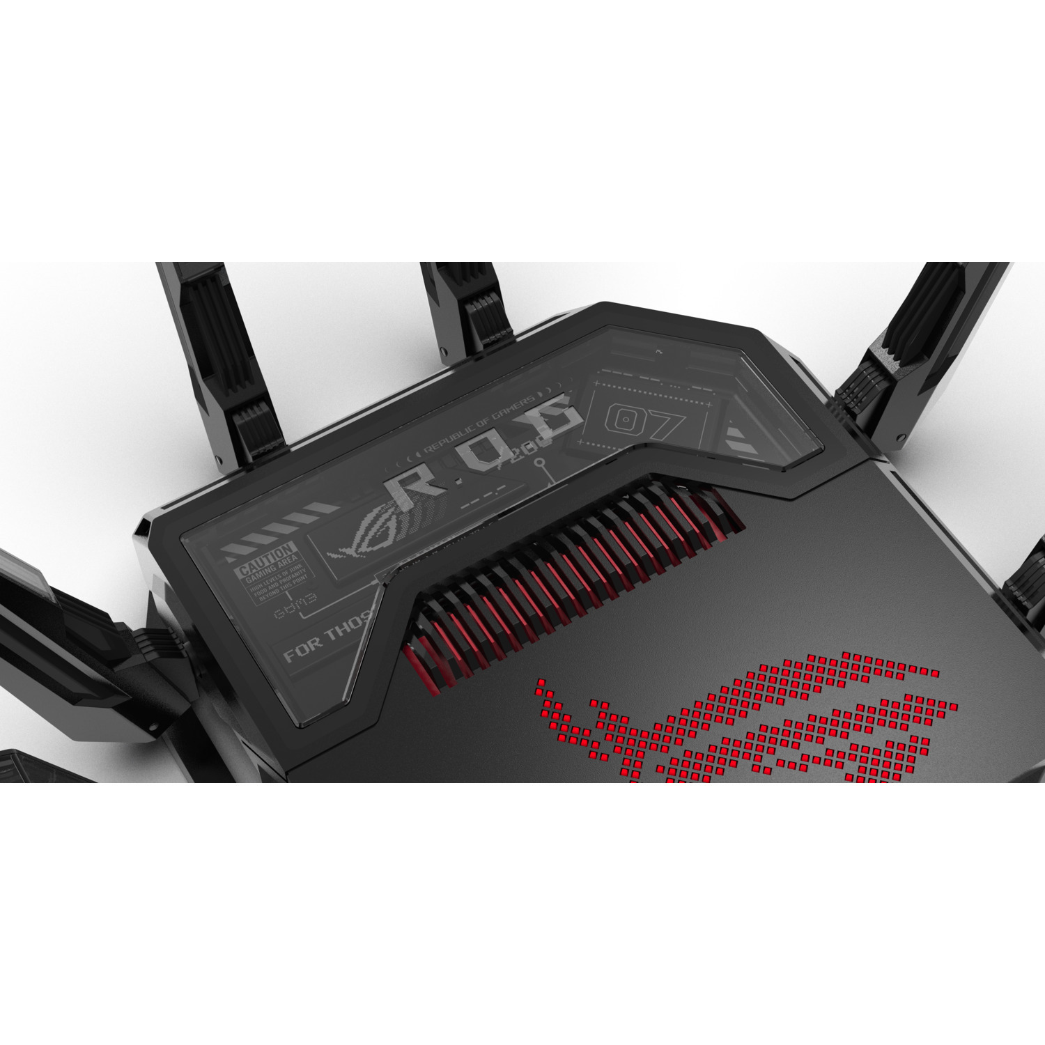 Routeur noir avec des accents rouges, logo ROG et plusieurs antennes. Le dessus a un couvercle transparent avec du texte.