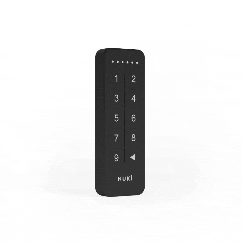 Un teclado Nuki negro con los números 1-9 y un botón de retroceso. Tiene seis puntos en la parte superior. Fondo blanco.