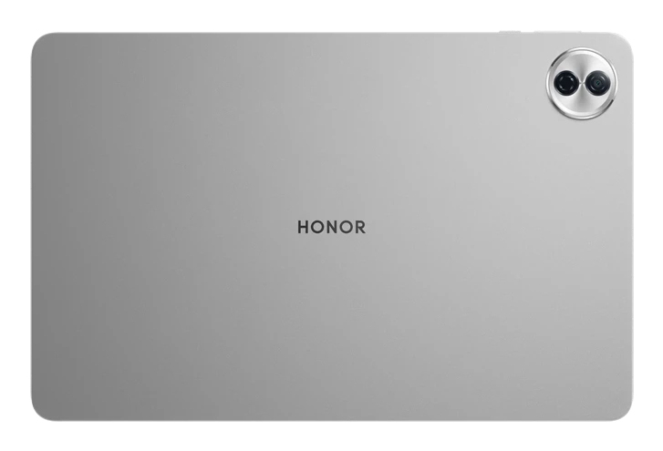 Parte trasera de una tableta plateada con la marca HONOR. Tiene un módulo de cámara de doble lente. El fondo es blanco.