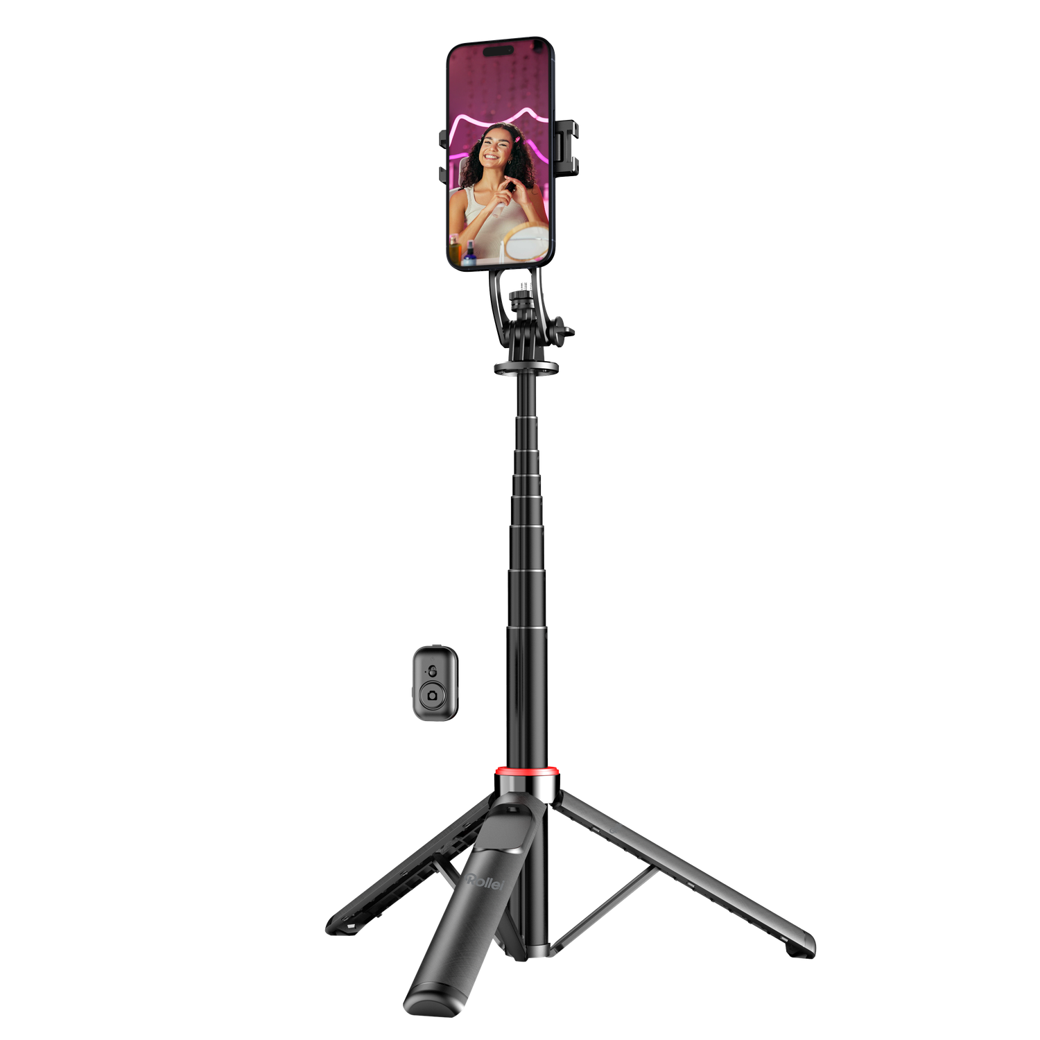 A smartphone on a tripod displays a woman on screen. A remote control is nearby. The scene is against a black background.