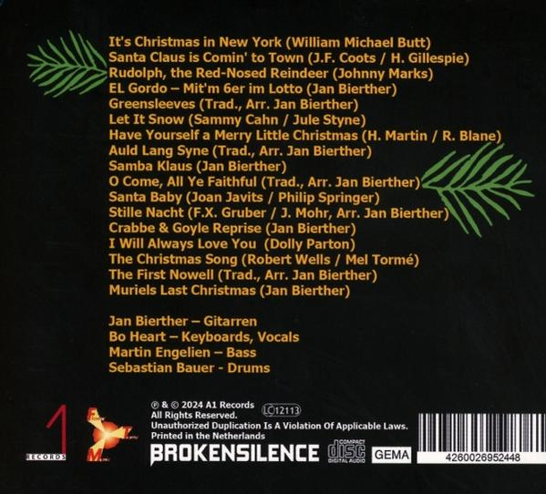 Albumcover mit grünem Tannenzweig-Design. Text listet Weihnachtslieder, Künstlernamen und Copyright-Informationen auf.