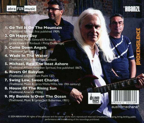 Albumcover mit drei Männern. Ein Mann mit langen weißen Haaren hält eine Gitarre. Der Hintergrund hat Songtitel und einen Barcode.