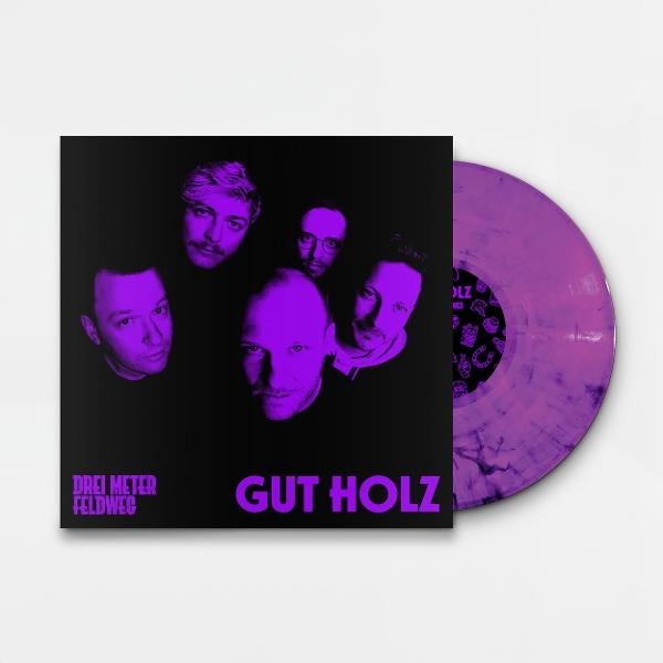 Albumcover mit sechs Männergesichtern in Lilatönen und einer lila Schallplatte. Der Text lautet "Drei Meter Feldweg" und "Gut Holz".