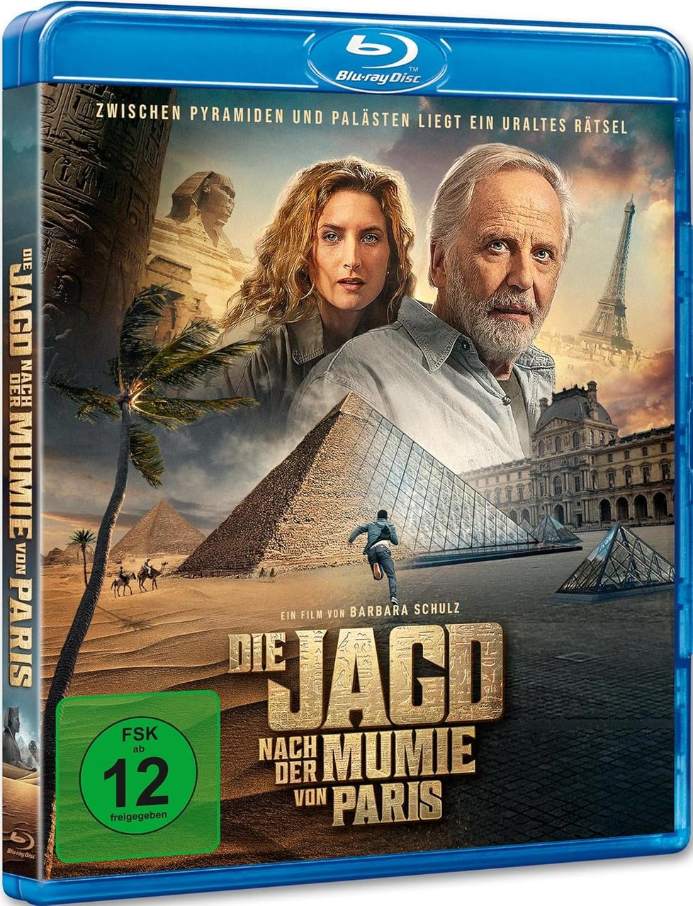 Blu-ray-Cover mit Schauspielern, Pyramiden, Eiffelturm und Filmtitel "Die Jagd nach der Mumie von Paris". Enthält FSK 12.