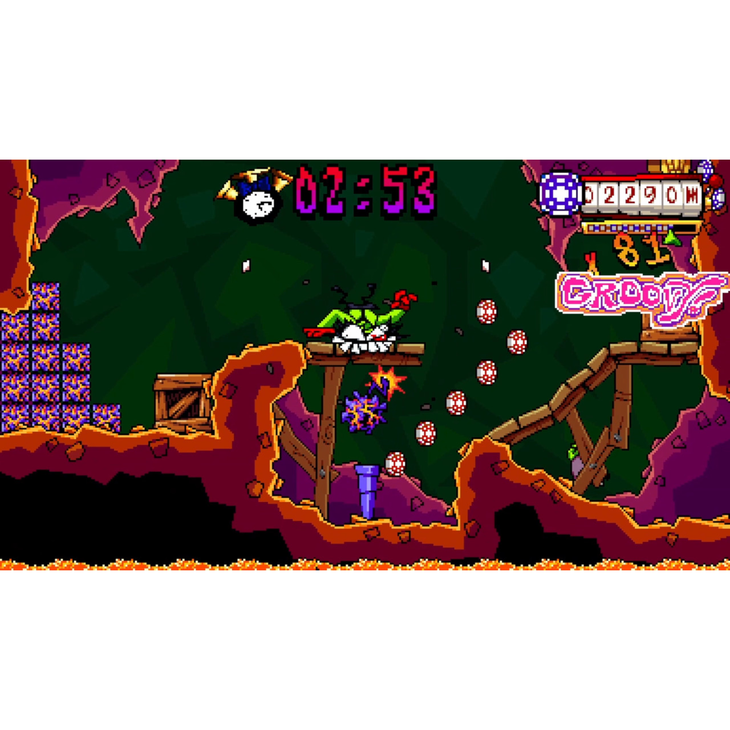 Een pixelige videogame scène. Een personage met groen haar springt over een houten constructie. Een timer toont 02:53. Munten en gezondheidsbalken zijn zichtbaar.