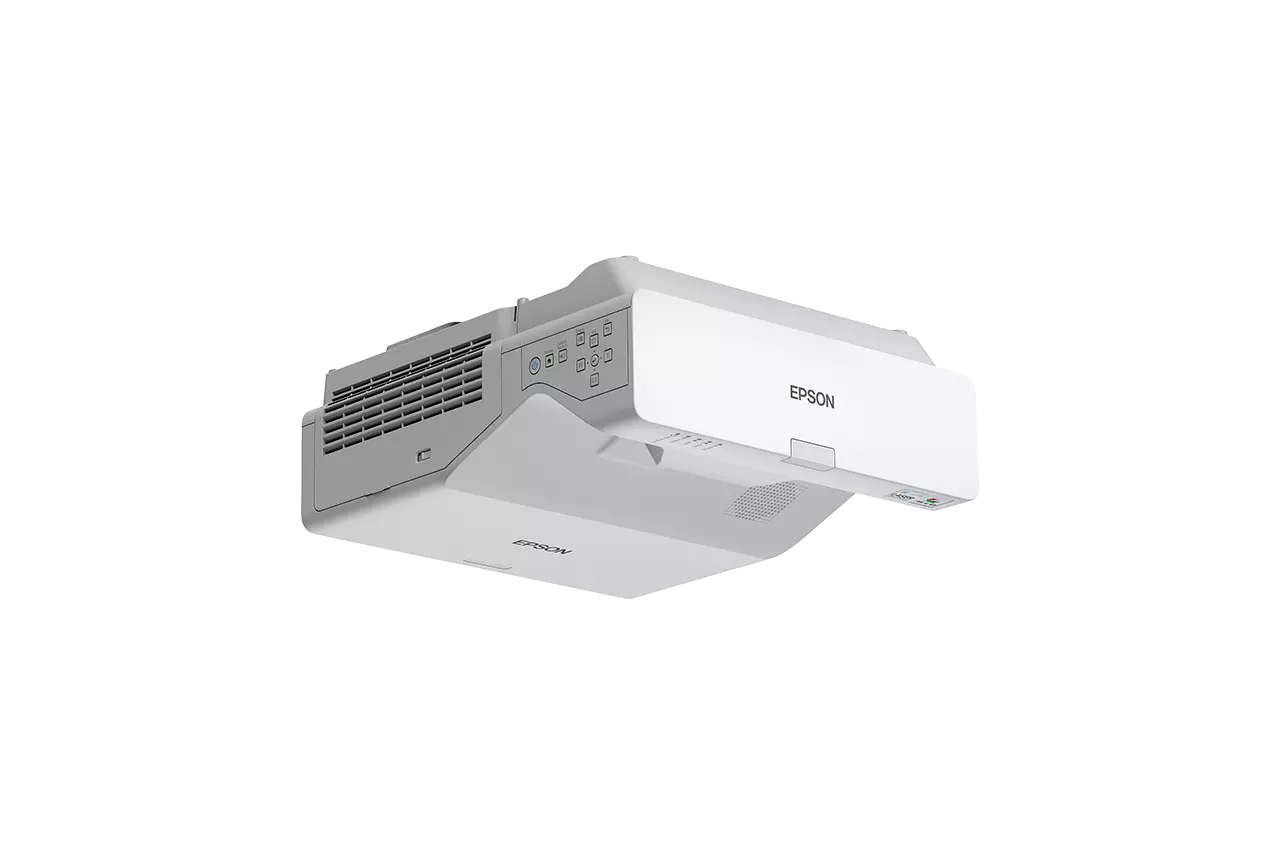 Egy fehér Epson projektor, alulról nézve, fekete háttér előtt. A projektoron az Epson logó és különféle bemeneti portok találhatók.